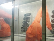 Sliding conveyor air intake grille robot spraying system