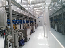 Continuous pass-through ground rail spray pretreatment line